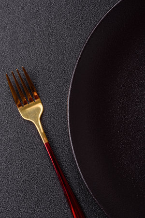 Empty plate with fork, cutlery for dinner table. Kitchen empty plate for mealsの写真素材