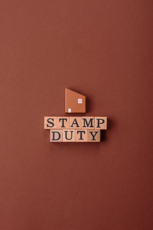 Stamp duty tax, property investment concept, business processes related to real estate. Stamp duty inscription as a background for business designの写真素材