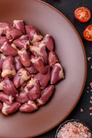 Chicken raw heart, red duck or turkey internal organs as an ingredient for dinner preparationの写真素材
