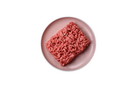 Stuffing or ground raw beef or pork with salt and spices on a black backgroundの写真素材