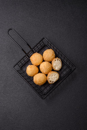 Cheese fried balls or croquettes with potatoes or rice. Snacks