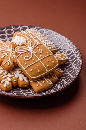 Christmas winter gingerbread, holiday biscuits on monochrome background. New Year gingerbread on the...