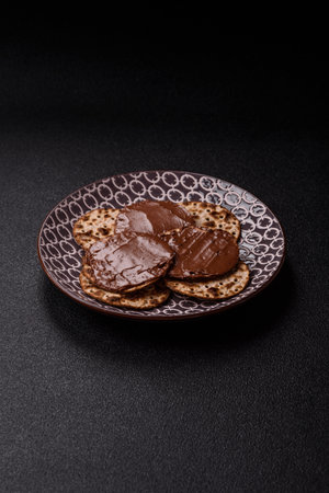 Matzah with chocolate paste for the Jewish holiday of passover for the festive table