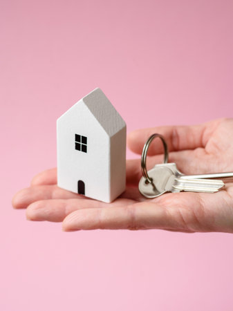 Home, house, buying property for business or life. Concept with human hand, house and keys