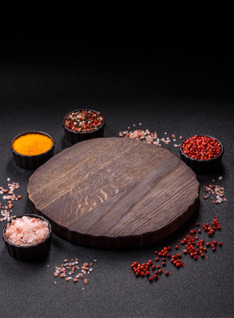 Wooden cutting board blank as a backdrop for cooking in the kitchen. Flat lay, copy space cutting board with salt and spicesの写真素材