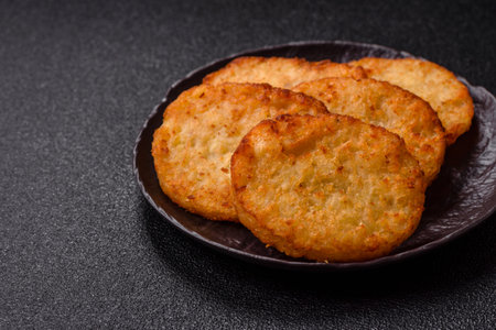 Potato hash browns, a meal with onions, cabbage in the form of fritters. Vegetable healthy breakfast