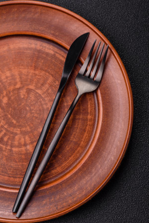 Empty plate with utensils as a conceptual background for lunch, breakfast, meal. Food background for your designの写真素材