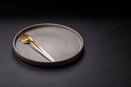 Empty plate with utensils as a conceptual background for lunch, breakfast, meal. Food background for your designの写真素材