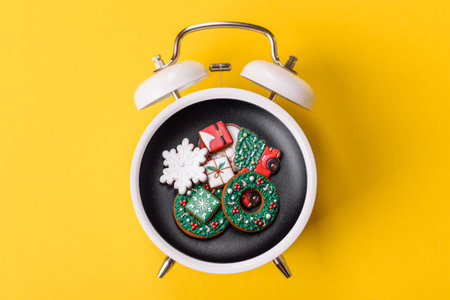 Christmas, gingerbread or biscuits on a plate on a vintage clock. Christmas time conceptual...