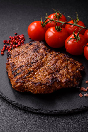Meat, steak, beef tenderloin cooked on grill. Juicy steak as a food background for your designの写真素材