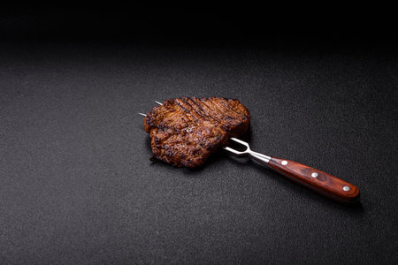 Meat, steak, beef tenderloin cooked on grill. Juicy steak as a food background for your designの写真素材