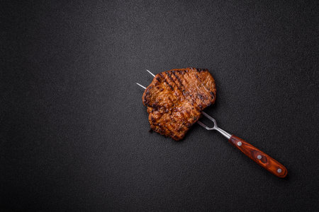 Meat, steak, beef tenderloin cooked on grill. Juicy steak as a food background for your designの写真素材