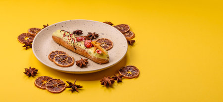 French food, dessert eclair with chocolate filling and covered with colored icing. Sweet eclair as a background for your designの写真素材