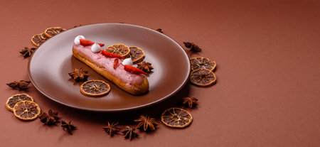 French food, dessert eclair with chocolate filling and covered with colored icing. Sweet eclair as a...