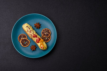 French food, dessert eclair with chocolate filling and covered with colored icing. Sweet eclair as a background for your designの写真素材