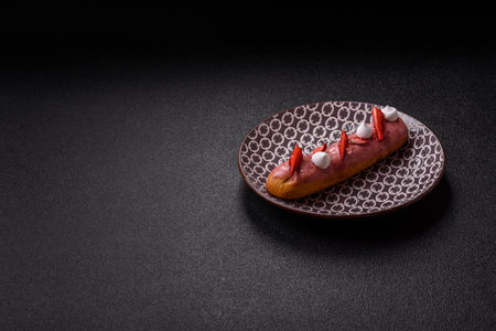 French food, dessert eclair with chocolate filling and covered with colored icing. Sweet eclair as a background for your designの写真素材