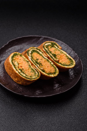 Roll of omelette, spinach, cheese and minced meat.の写真素材