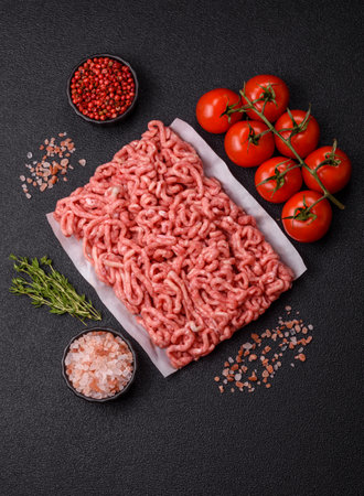 Raw ground beef or pork as an ingredient for burgers. Raw minced meat for cooking at home