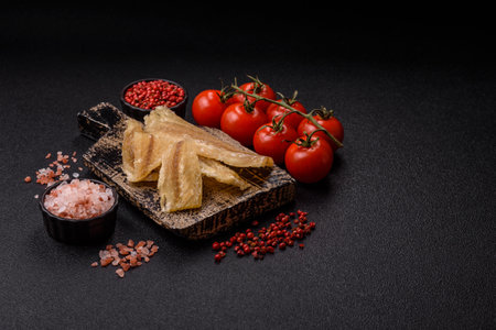 Dried salted fish, snacks or jerky, slices of white fish fillets. Jerks, partyの写真素材