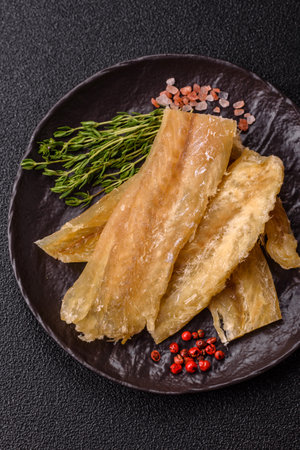 Dried salted fish, snacks or jerky, slices of white fish fillets.