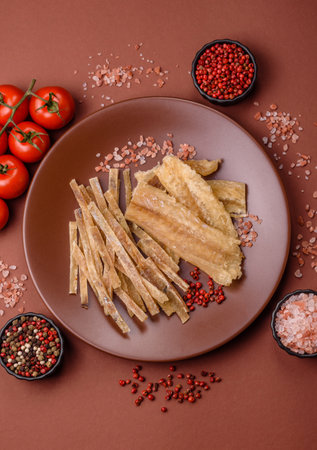 Dried salted fish, snacks or jerky, slices of white fish fillets.