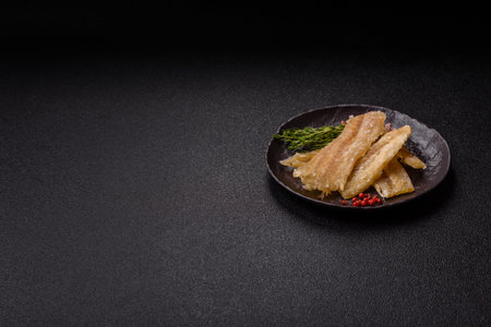 Dried salted fish, snacks or jerky, slices of white fish fillets.
