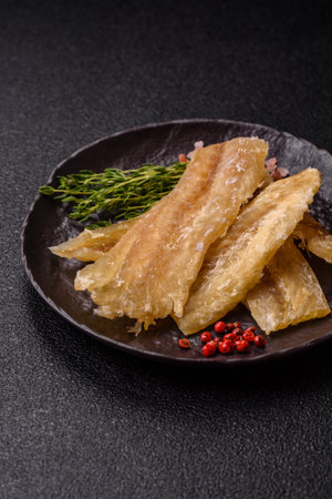 Dried salted fish, snacks or jerky, slices of white fish fillets.