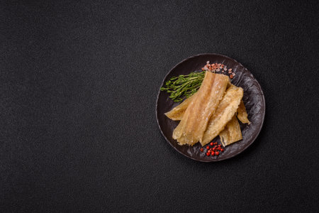 Dried salted fish, snacks or jerky, slices of white fish fillets.