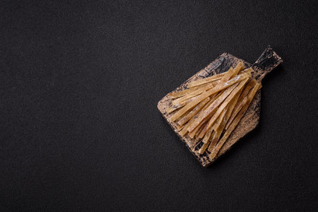 Food, snacks or jerky made from dried dehydrated salted fish with spices.