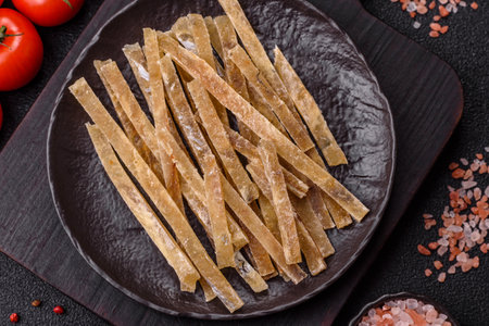 Food, snacks or jerky made from dried dehydrated salted fish with spices.