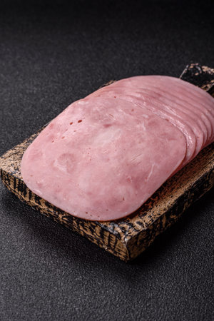 Sliced ham, meat or pork sausage for sandwiches. Cooked smoked prosciutto, ham as an ingredient for...