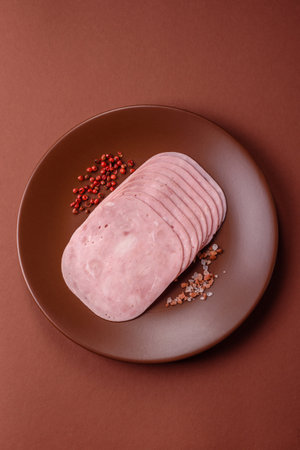 Sliced ham, meat or pork sausage for sandwiches. Cooked smoked prosciutto, ham as an ingredient for your dishesの写真素材