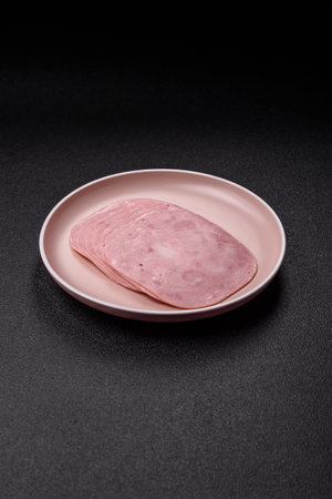 Sliced ham, meat or pork sausage for sandwiches. Cooked smoked prosciutto, ham as an ingredient for...