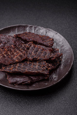 Snacks or jerky, beef slice meat dried, dehydrated. Beef snack, chewy meat for beerの写真素材
