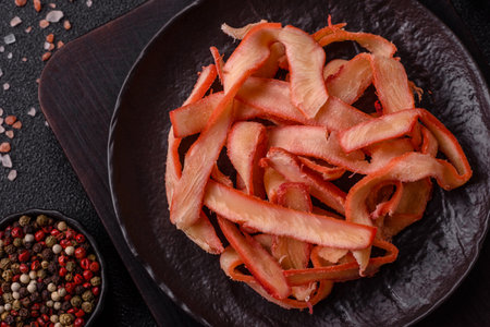 Food, dried squid in shavings or chopped as snacks or jerky. Snack dried squid for beer, background for your designの写真素材