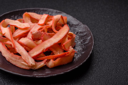 Food, dried squid in shavings or chopped as snacks or jerky. Snack dried squid for beer, background for your designの写真素材