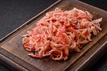 Food, dried squid in shavings or chopped as snacks or jerky. Snack dried squid for beer, background for your designの写真素材