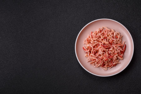 Food, dried squid in shavings or chopped as snacks or jerky. Snack dried squid for beer, background...