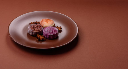 Chinese mooncake is an Asian sweet dessert with a coating of rice dough and fruit filling. Asian...
