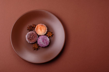 Chinese mooncake is an Asian sweet dessert with a coating of rice dough and fruit filling. Asian...