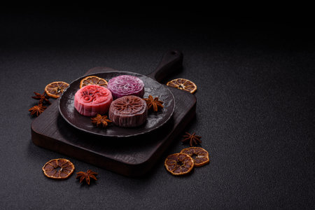 Chinese mooncake is an Asian sweet dessert with a coating of rice dough and fruit filling. Asian...
