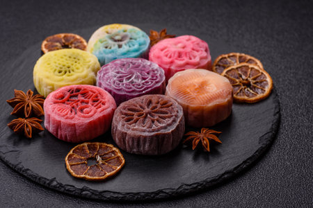 Chinese mooncake is an Asian sweet dessert with a coating of rice dough and fruit filling. Asian mooncake as a background for your designの写真素材