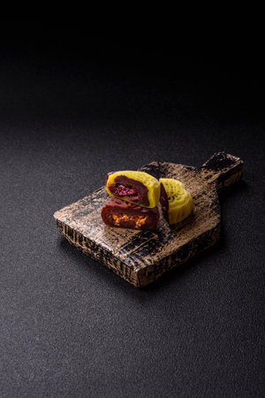 Chinese mooncake is an Asian sweet dessert with a coating of rice dough and fruit filling. Asian...