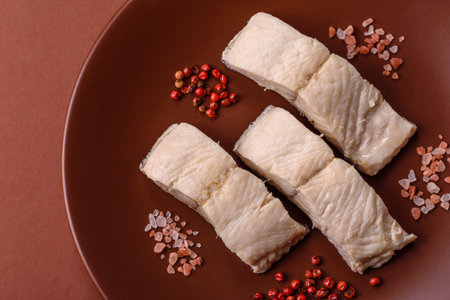 White fish fillets, seafood cooked with salt and spices. Fish fillets on a ceramic plate