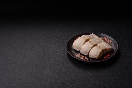 White fish fillets, seafood cooked with salt and spices. Fish fillets on a ceramic plateの写真素材