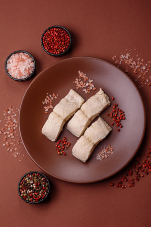 White fish fillets, seafood cooked with salt and spices. Fish fillets on a ceramic plate
