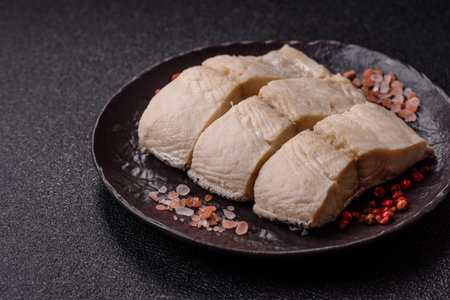 White fish fillets, seafood cooked with salt and spices. Fish fillets on a ceramic plateの写真素材