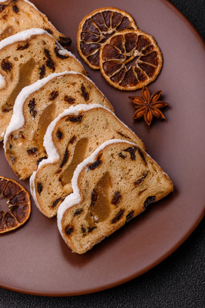 Christmas stollen, a German sweet cake with marzipan fruit and candied fruit. Winter Christmas...