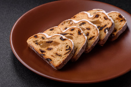 Christmas stollen, a German sweet cake with marzipan fruit and candied fruit. Winter Christmas...