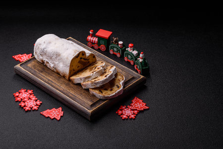 Christmas stollen, a German sweet cake with marzipan fruit and candied fruit. Winter Christmas...